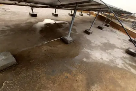 Water leakage on concrete roof under solar panels before PU waterproofing